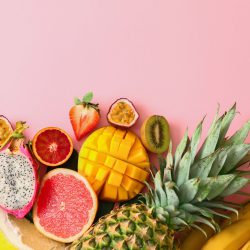 Assortment of exotic fruits on color background